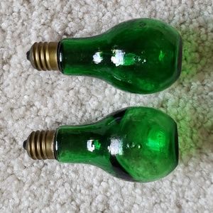 Two 1960s vintage pop art salt shakers Green glass in the shape of light bulbs